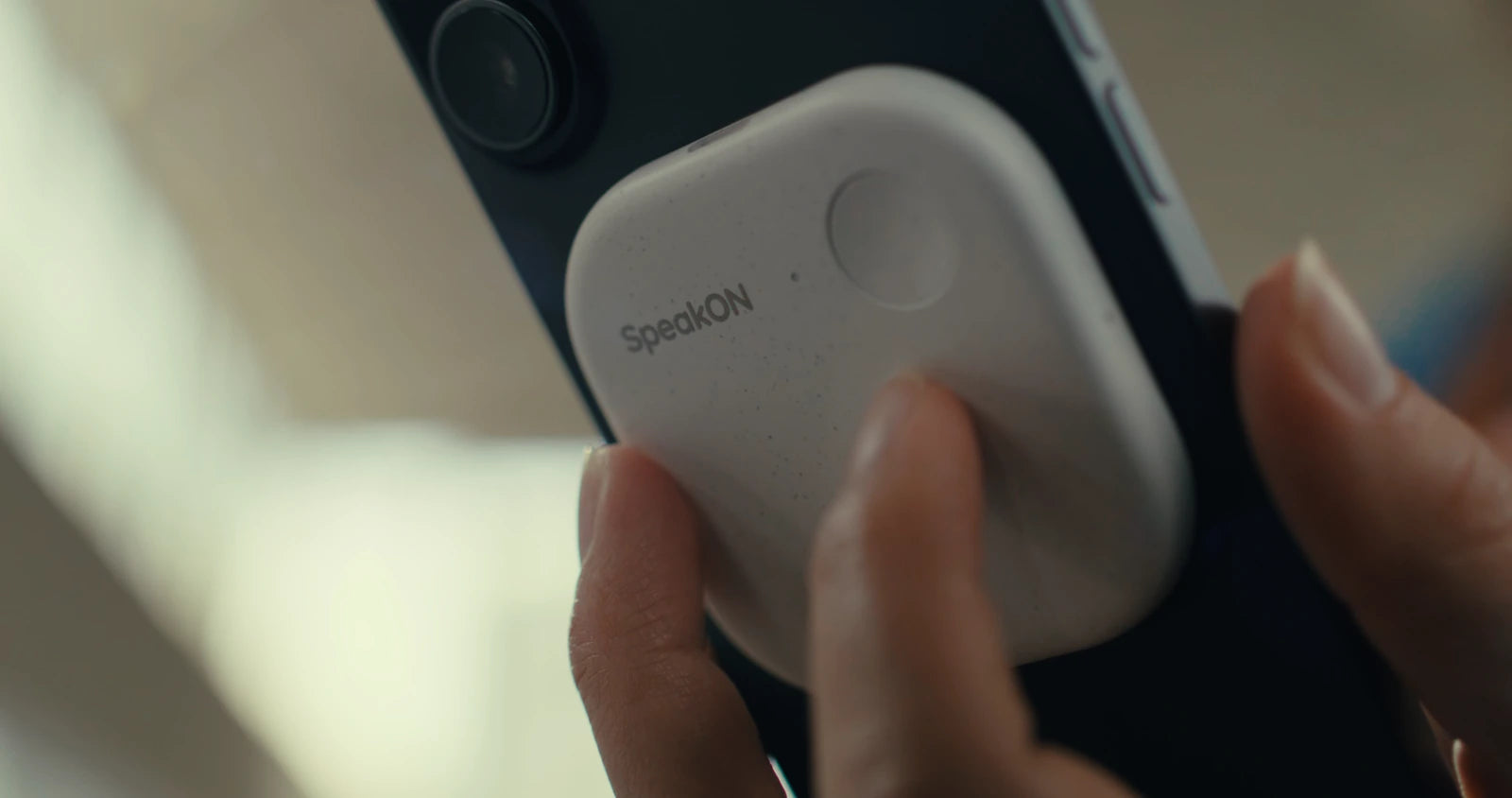 Pressing the SpeakON button attached to an iPhone